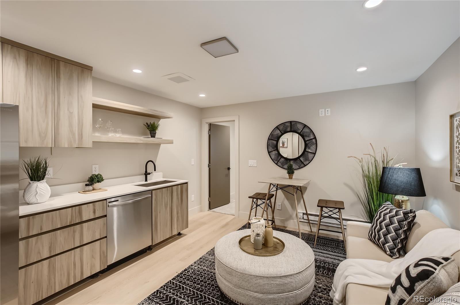 2323 South High Street Denver, CO 80210 - Photo 16 of 21 a living room with furniture a mirror and a sink
