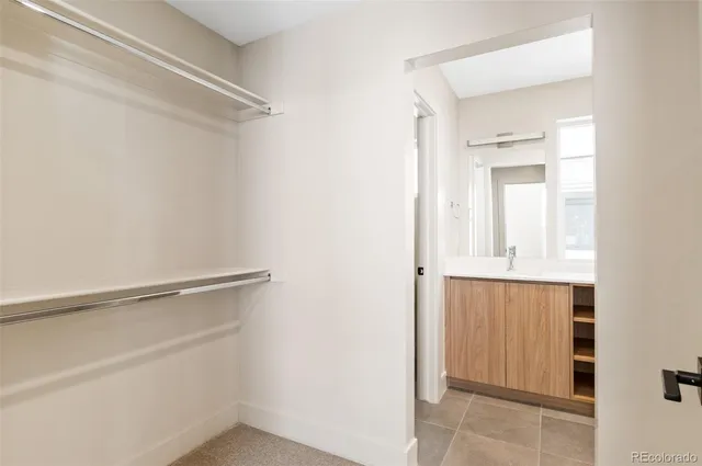 a bathroom with a double vanity sink mirror and double