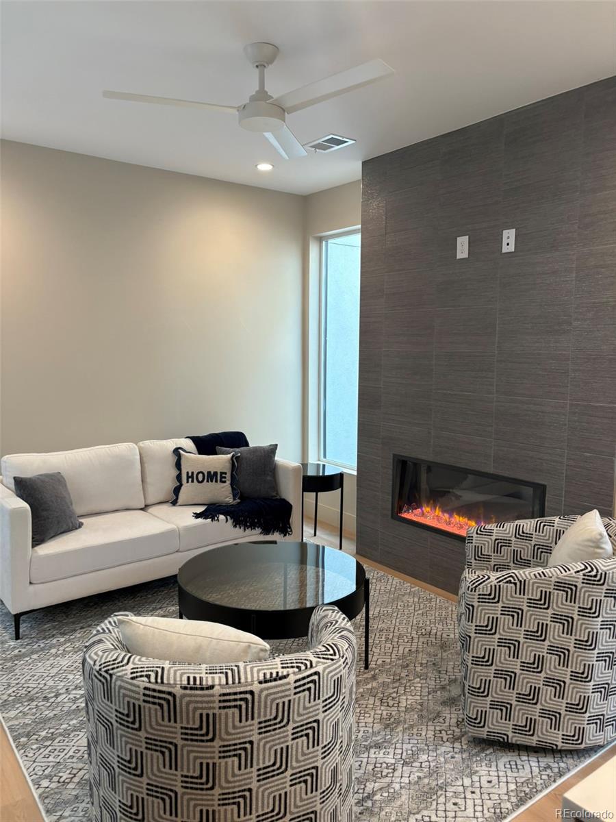 2323 South High Street Denver, CO 80210 - Photo 4 of 21 a living room with furniture