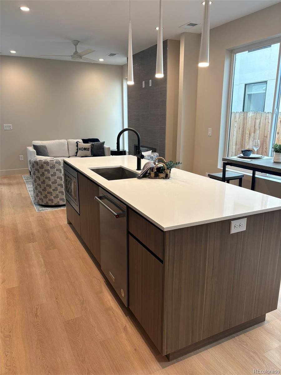 2323 South High Street Denver, CO 80210 - Photo 5 of 21 a bathroom with a double vanity sink and a mirror