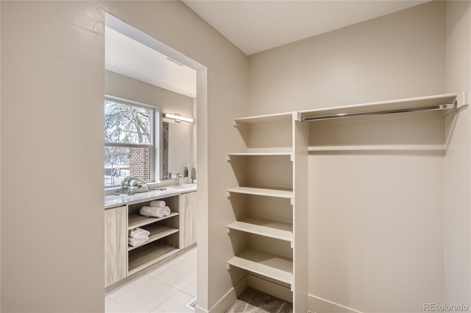 2323 South High Street Denver, CO 80210 - Photo 10 of 21 a view of a room with rack on the wall