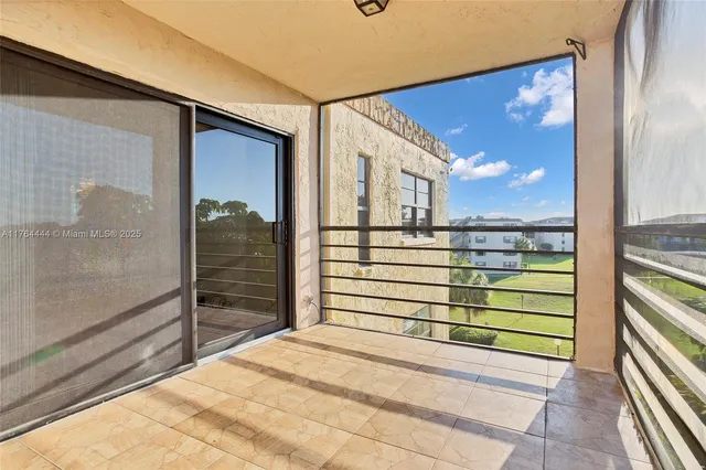 a view of a balcony with a potted plant
