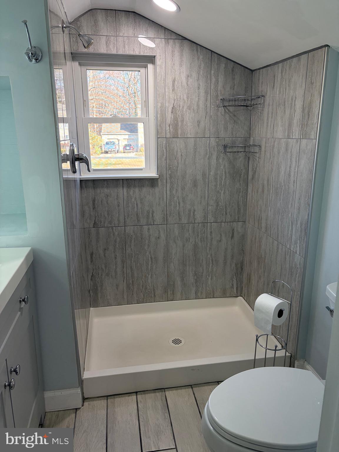 1806 Johnson Road Annapolis, MD 21409 - Photo 17 of 31 a bathroom with a bathtub a window and a shower