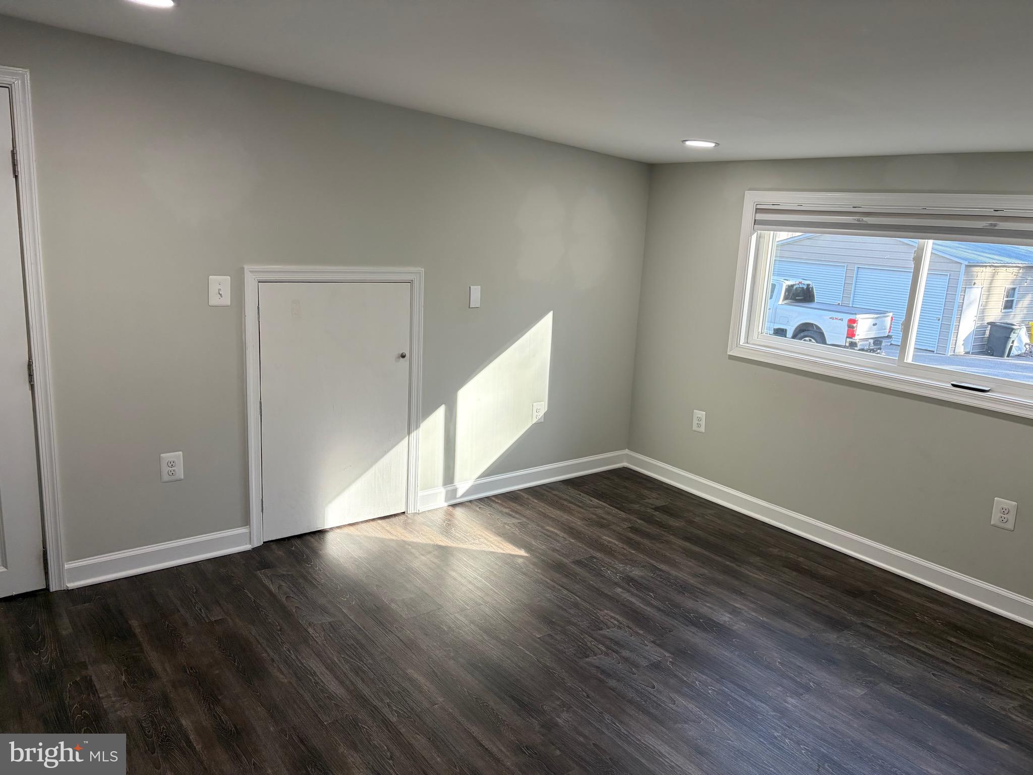 1806 Johnson Road Annapolis, MD 21409 - Photo 20 of 31 a view of an empty room with wooden floor and a window