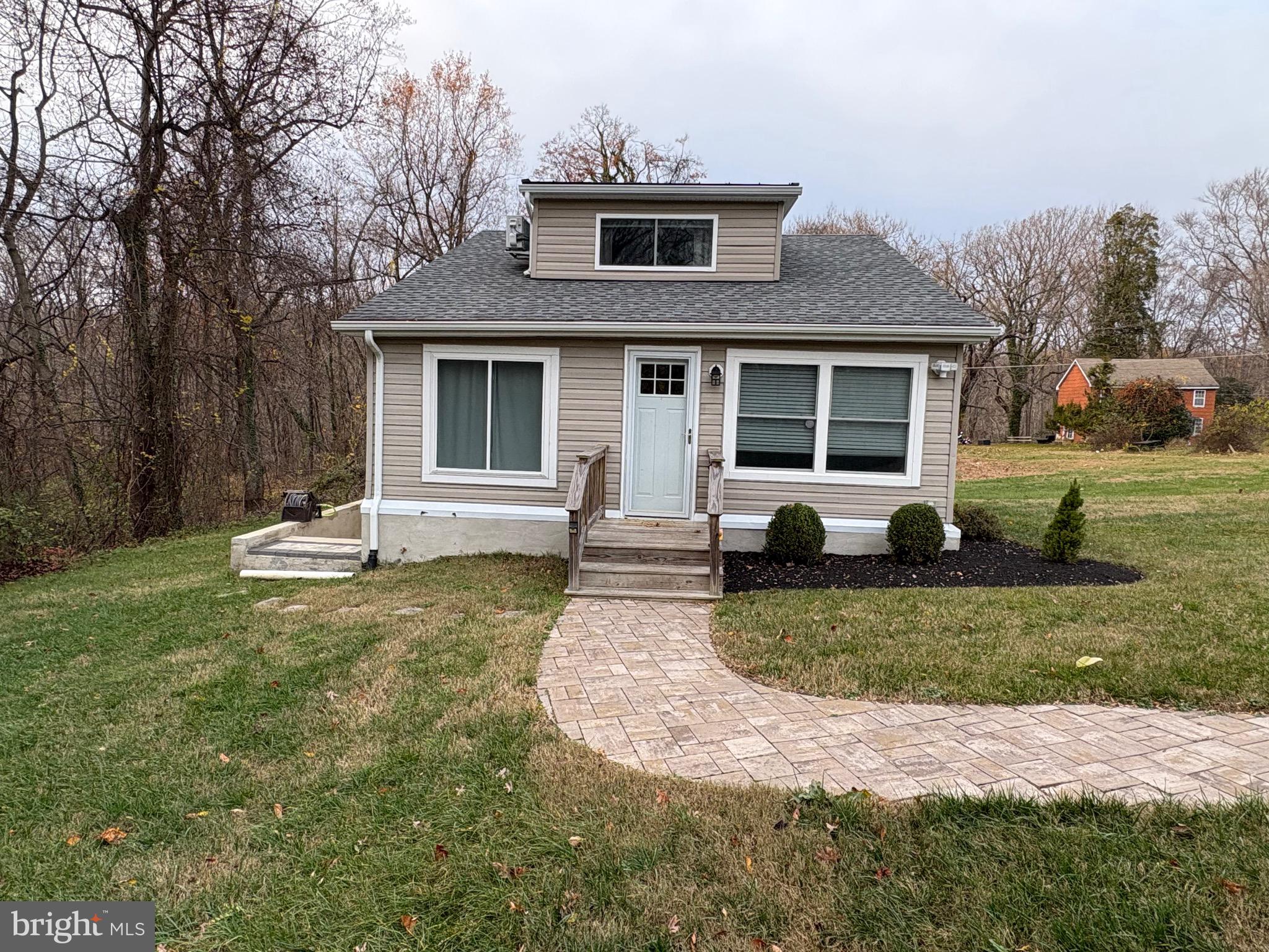 1806 Johnson Road Annapolis, MD 21409 - Photo 2 of 31 a front view of a house with a yard and garage