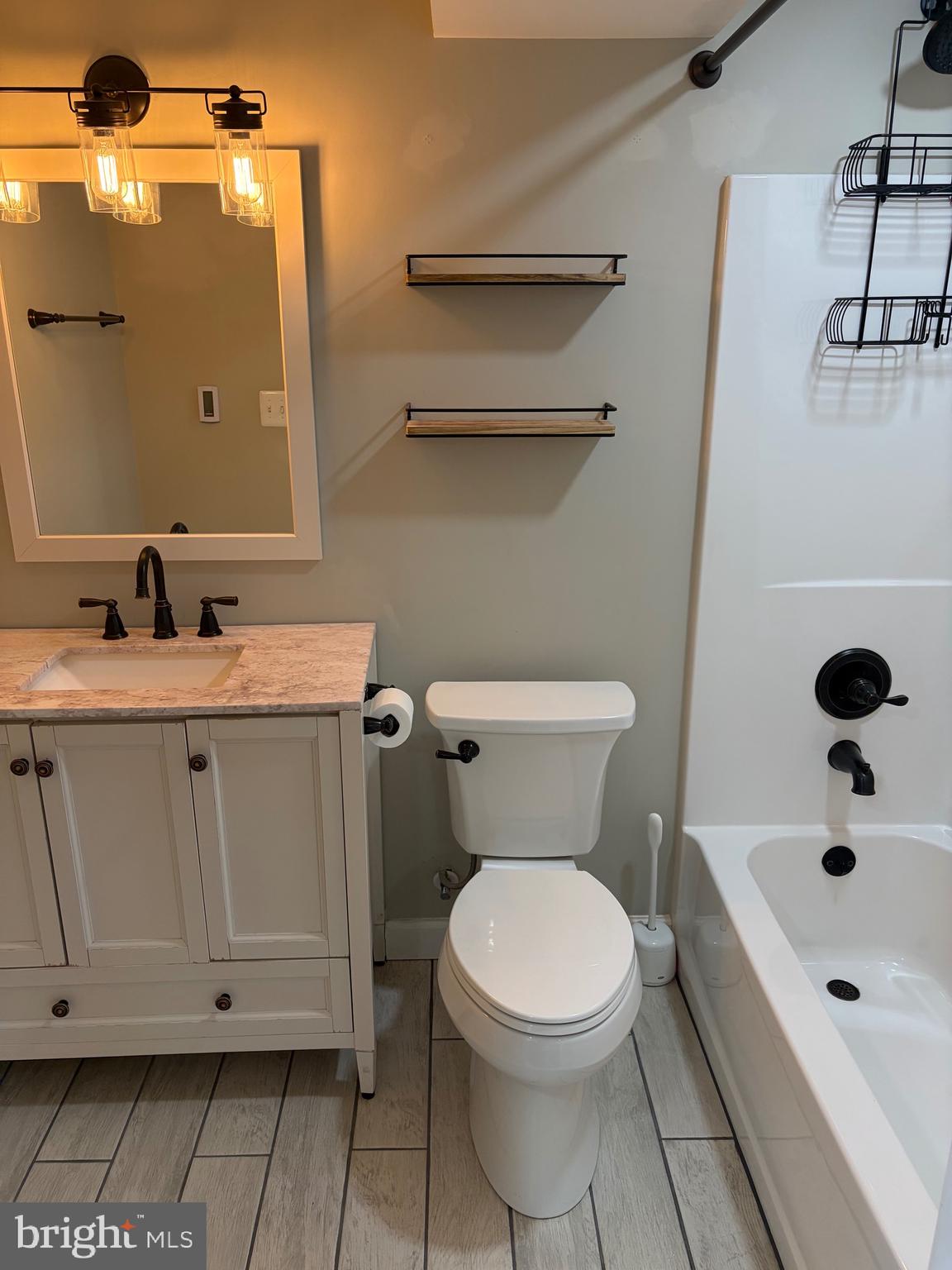 1806 Johnson Road Annapolis, MD 21409 - Photo 27 of 31 a bathroom with a sink a toilet and shower