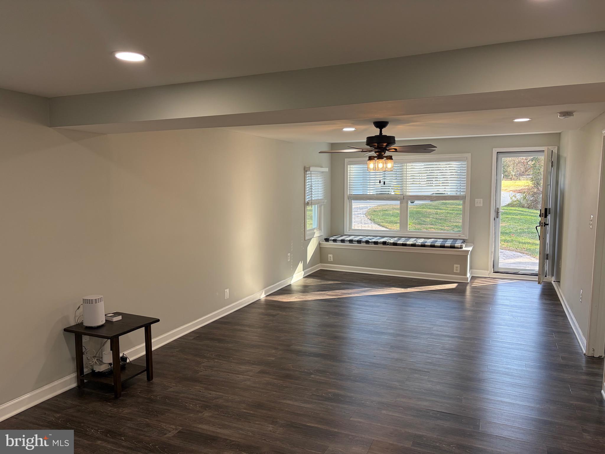 1806 Johnson Road Annapolis, MD 21409 - Photo 31 of 31 an empty room with wooden floor and a floor to ceiling window