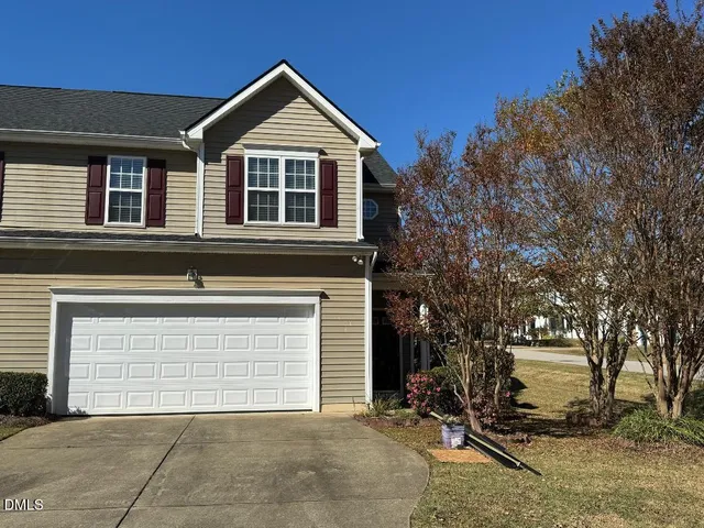 a front view of a house with a garage