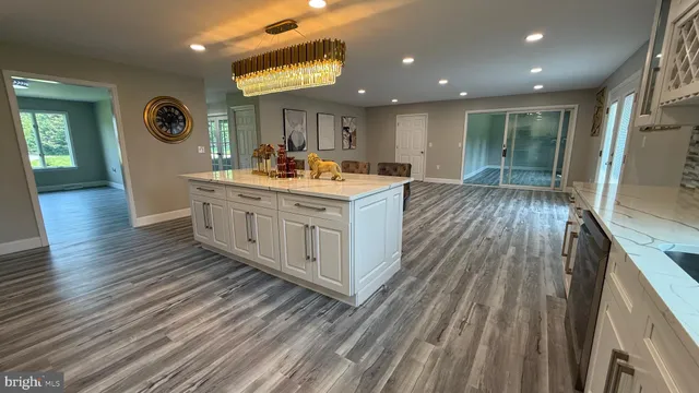a bathroom with a double vanity sink toilet and a bathtub