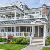 a view of a brick building next to a yard