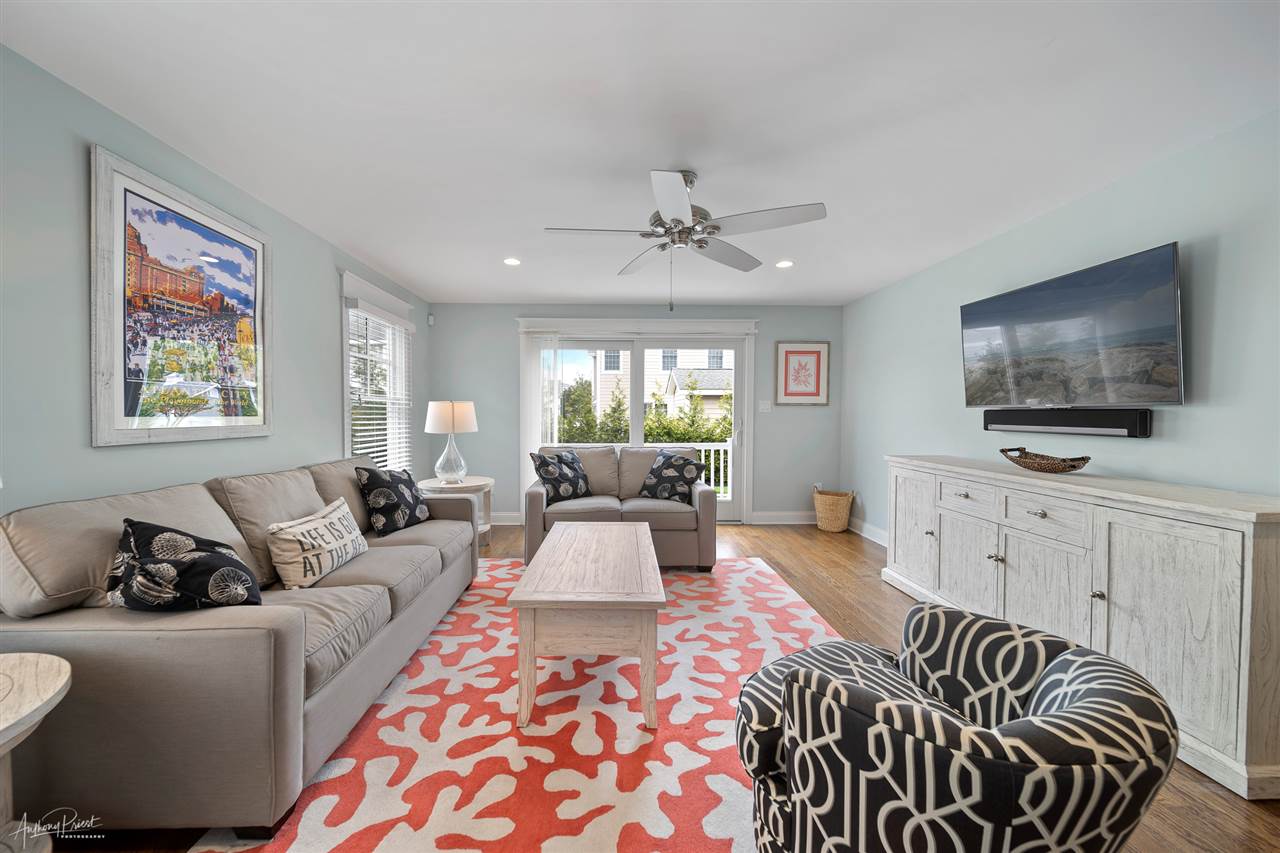 45 West 26th Avalon, NJ 08202 - Photo 20 of 24 a living room with furniture and a flat screen tv