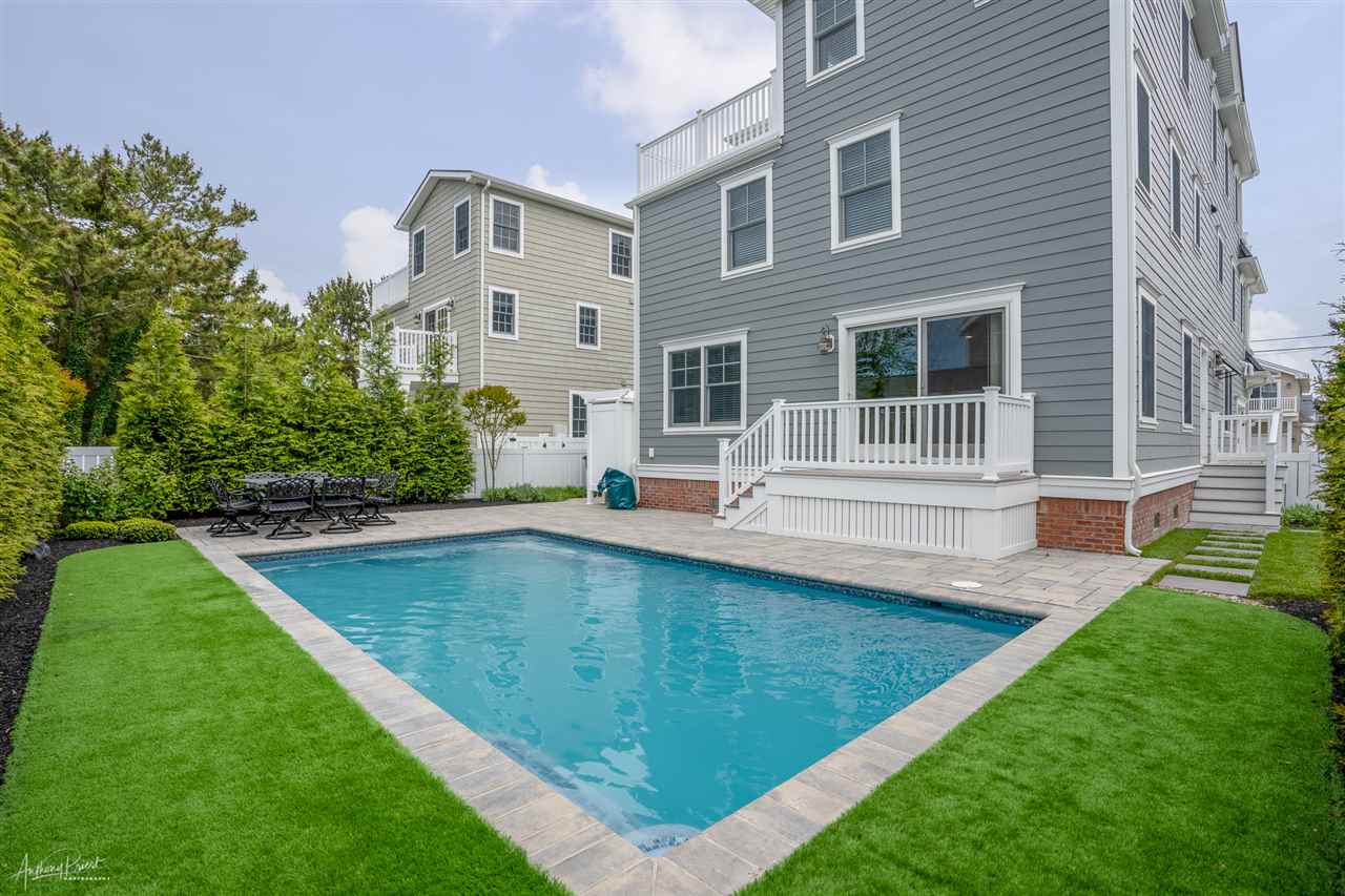 45 West 26th Avalon, NJ 08202 - Photo 21 of 24 a view of a house with a swimming pool
