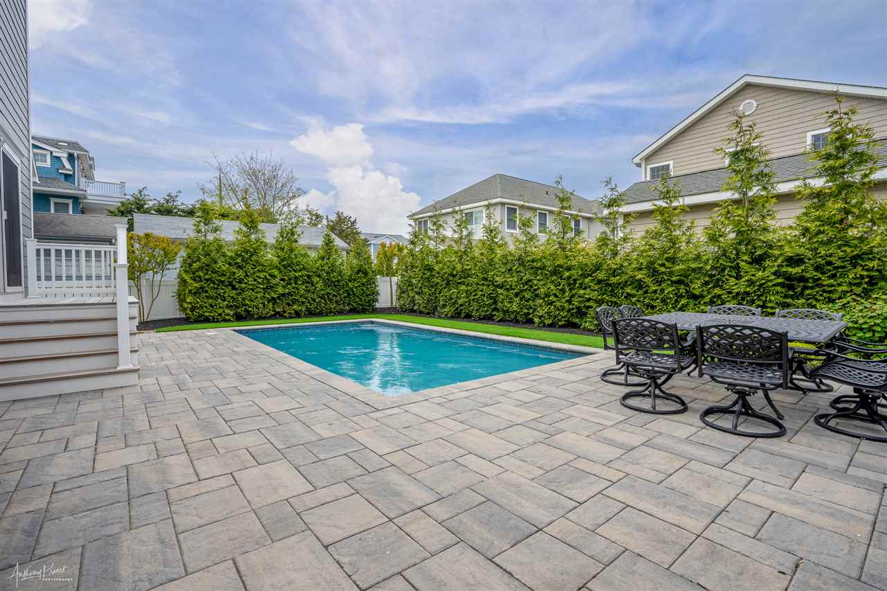 45 West 26th Avalon, NJ 08202 - Photo 23 of 24 a view of a chairs and table in backyard of the house
