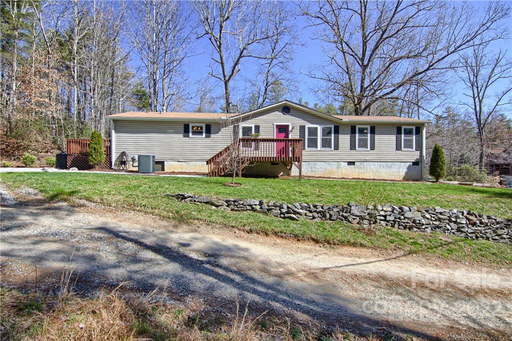 20 Cascade Village Road, Unit 2 Pisgah Forest, NC 28768 - Photo 1 of 36 a front view of a house with a yard