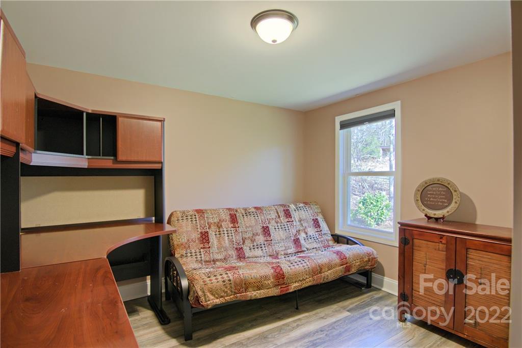 20 Cascade Village Road, Unit 2 Pisgah Forest, NC 28768 - Photo 24 of 36 a bedroom with a bed and window