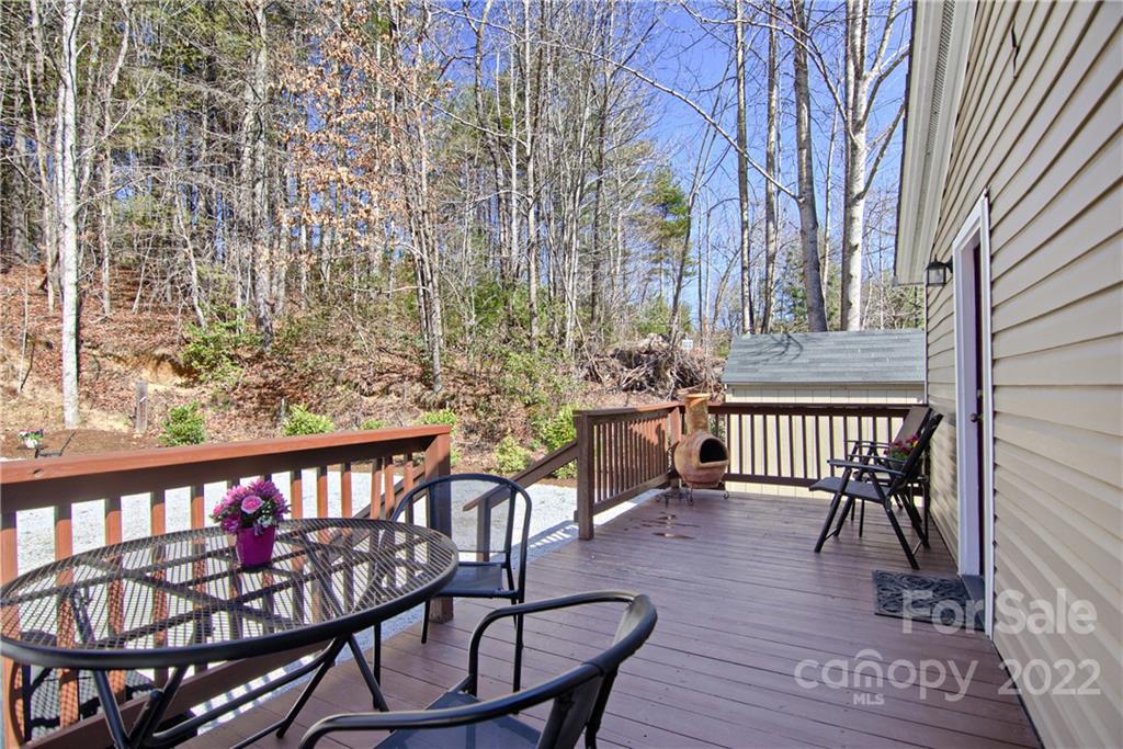 20 Cascade Village Road, Unit 2 Pisgah Forest, NC 28768 - Photo 26 of 36 a view of a chairs and table on the wooden floor