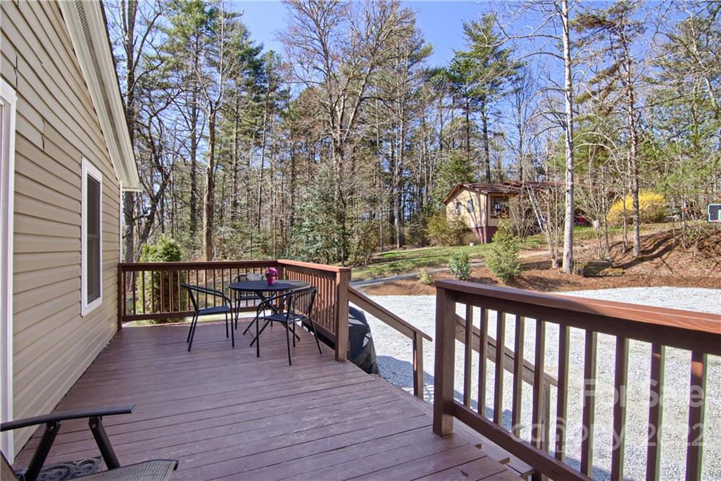 20 Cascade Village Road, Unit 2 Pisgah Forest, NC 28768 - Photo 28 of 36 a view of a two chairs and table in the balcony