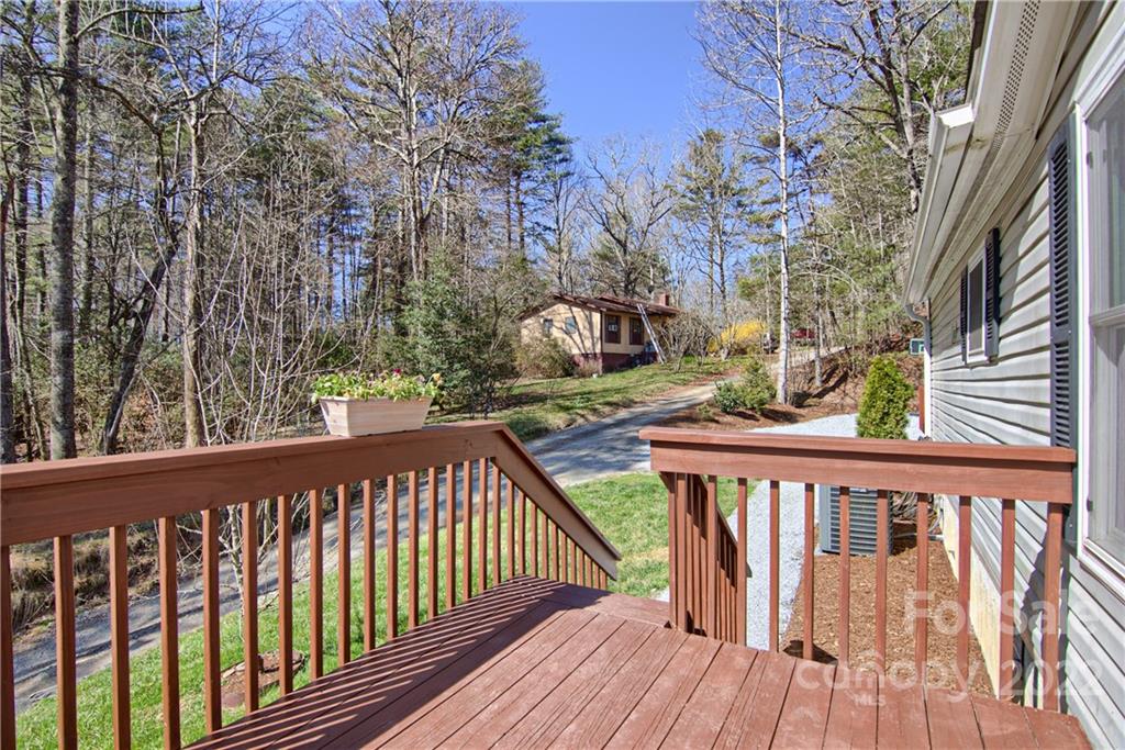 20 Cascade Village Road, Unit 2 Pisgah Forest, NC 28768 - Photo 33 of 36 a view of a balcony with wooden floor and fence