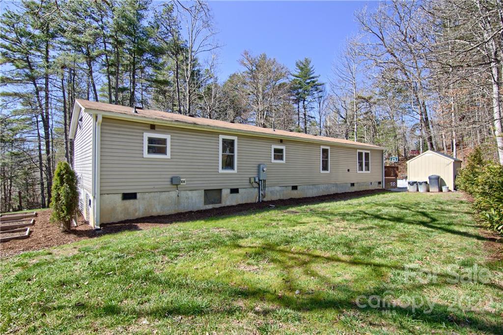 20 Cascade Village Road, Unit 2 Pisgah Forest, NC 28768 - Photo 36 of 36 a view of a backyard with a house