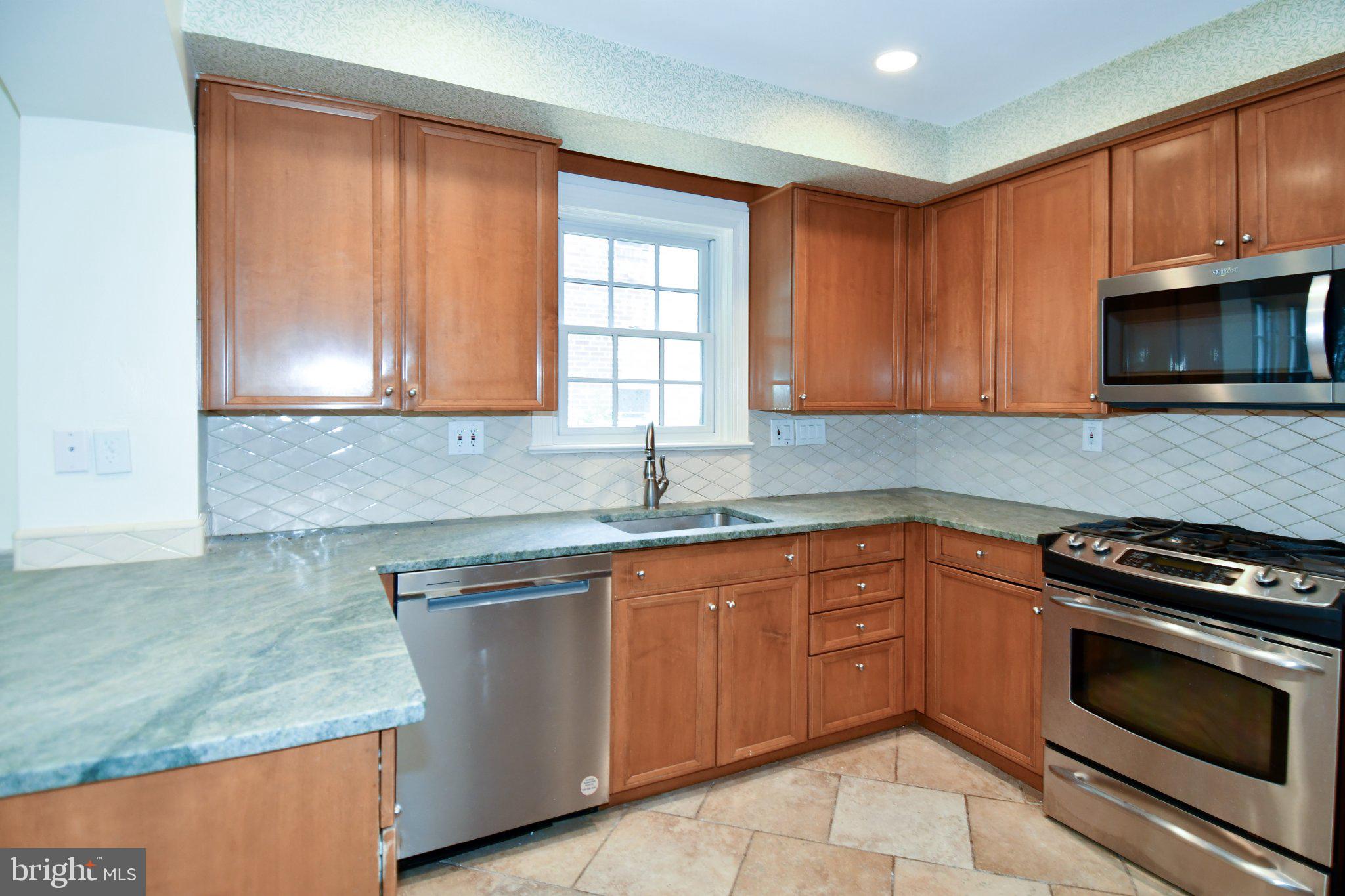 2608 Fordham Road Alexandria, VA 22302 - Photo 9 of 46 Modern kitchen with warm wood tones.