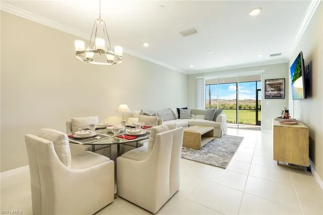 a dining room with a table and chairs