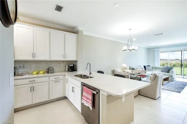 a kitchen with granite countertop a sink and cabinets