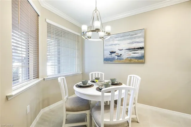 a spacious bedroom with a bed and a large window