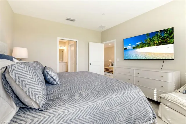 a bathroom with a double vanity sink mirror and toilet