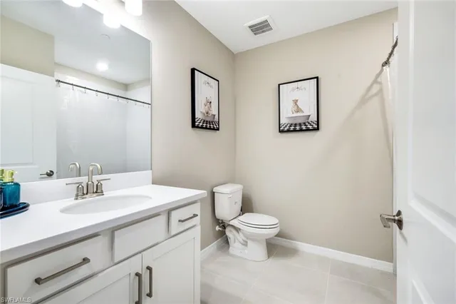 a living room with furniture a table and chair