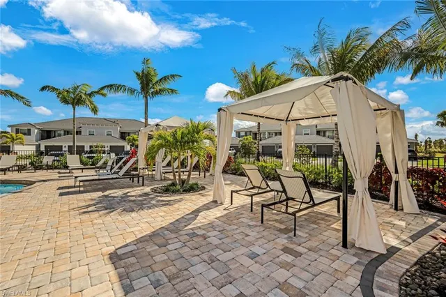 an aerial view of multiple house with a lake view