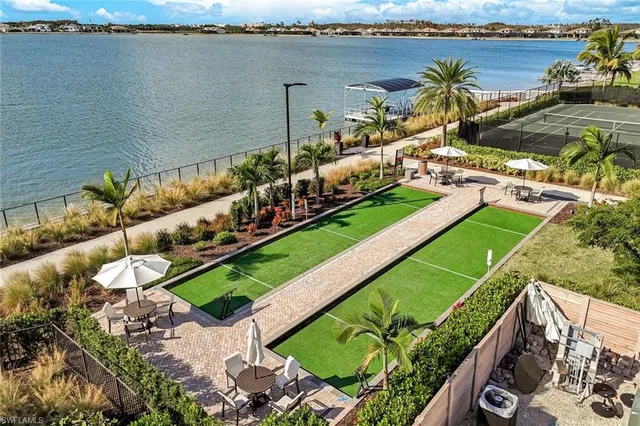 an aerial view of a residential houses with outdoor space
