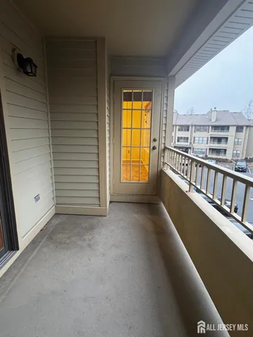 a bathroom with a granite countertop sink and a bathtub
