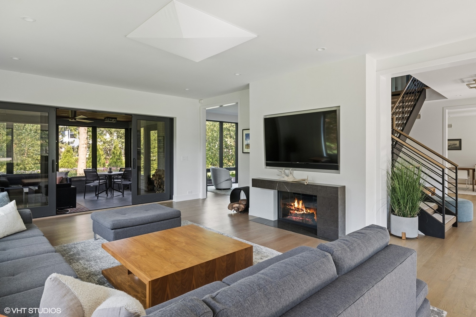 15 Longmeadow Road Winnetka, IL 60093 - Photo 19 of 71 a living room with furniture fireplace and flat screen tv