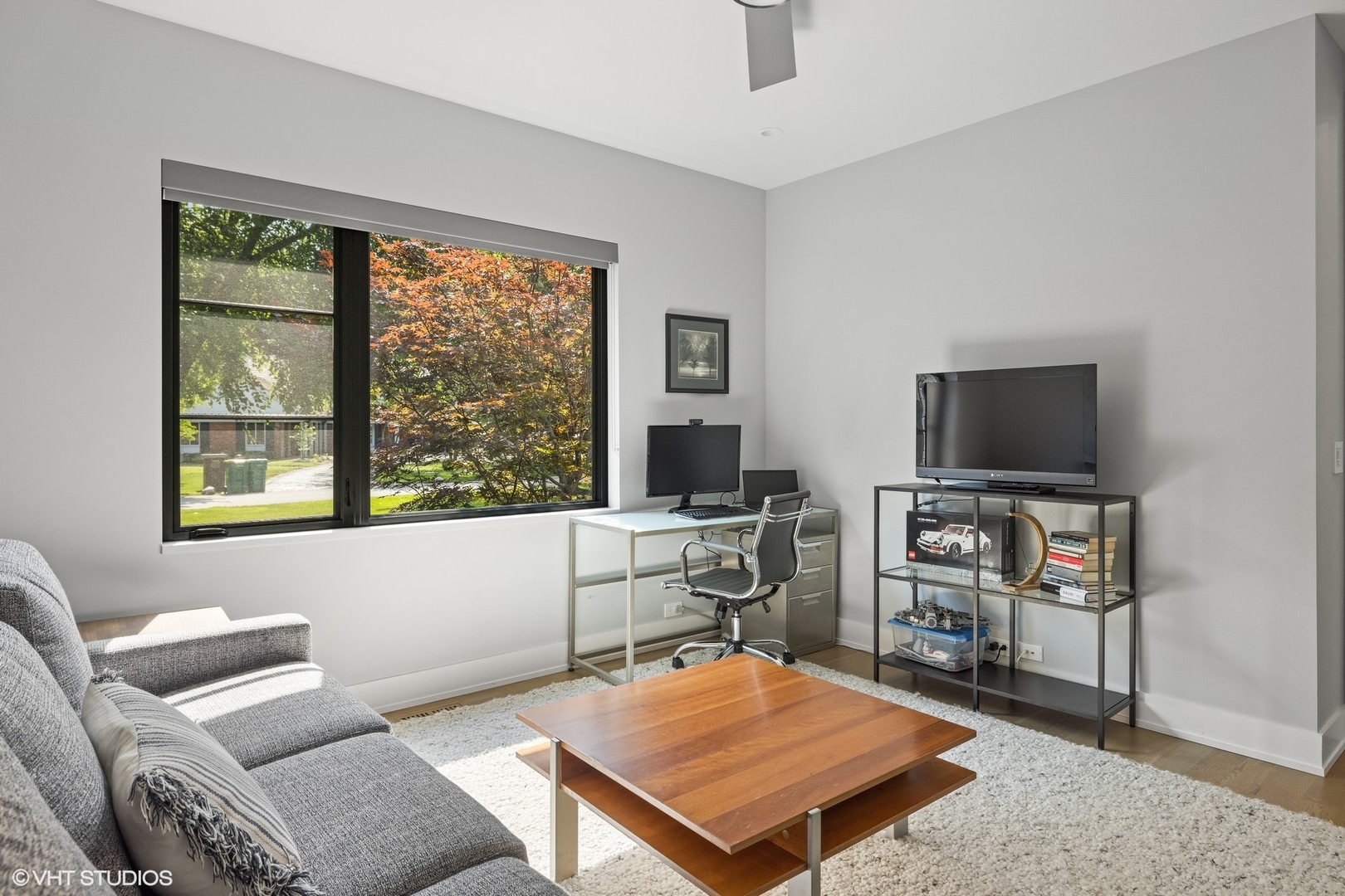15 Longmeadow Road Winnetka, IL 60093 - Photo 25 of 71 a living room with furniture a flat screen tv and a window