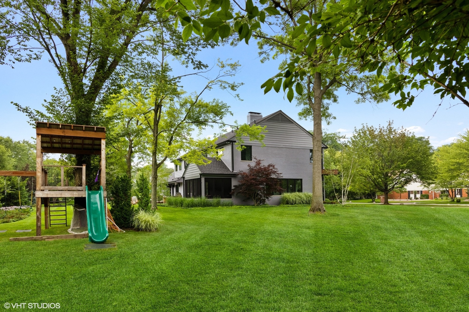 15 Longmeadow Road Winnetka, IL 60093 - Photo 51 of 71 a view of a house with a backyard
