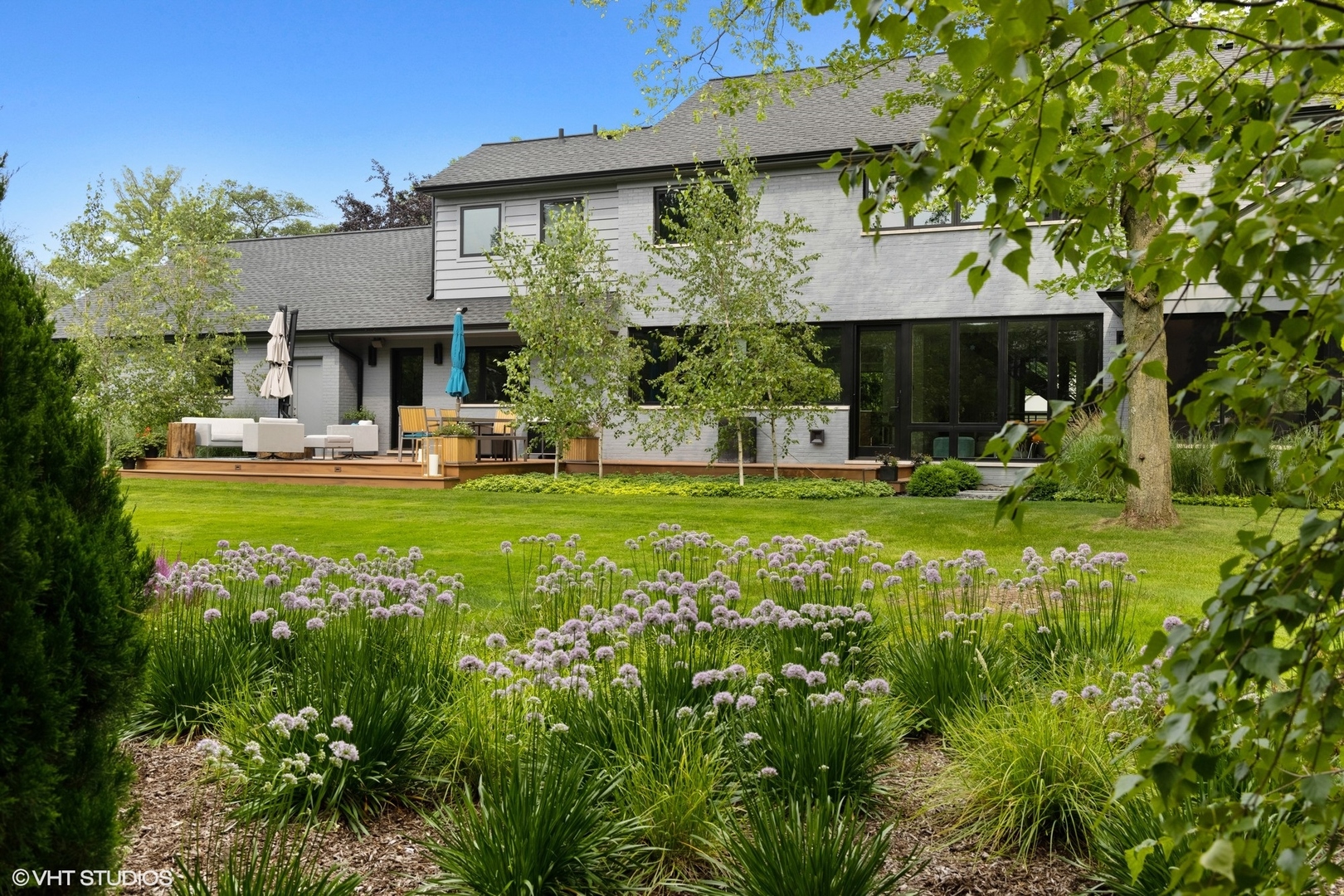 15 Longmeadow Road Winnetka, IL 60093 - Photo 55 of 71 a view of a house with a yard and sitting area