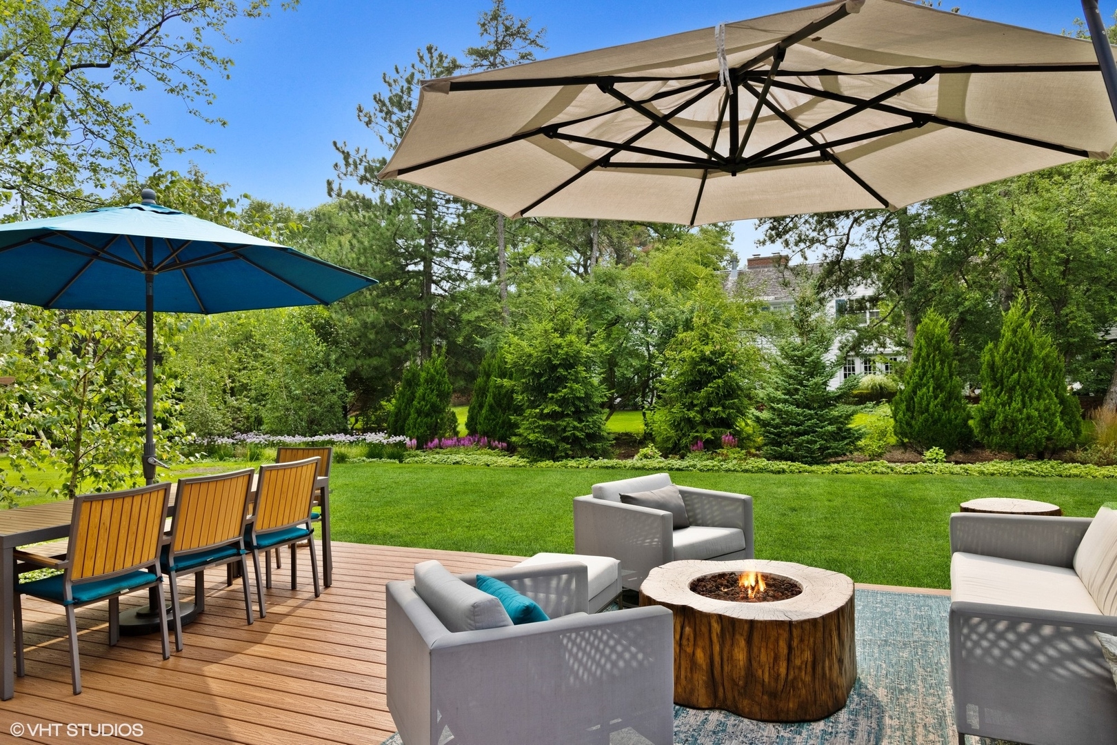 15 Longmeadow Road Winnetka, IL 60093 - Photo 60 of 71 a view of a patio with chairs and a table under an umbrella