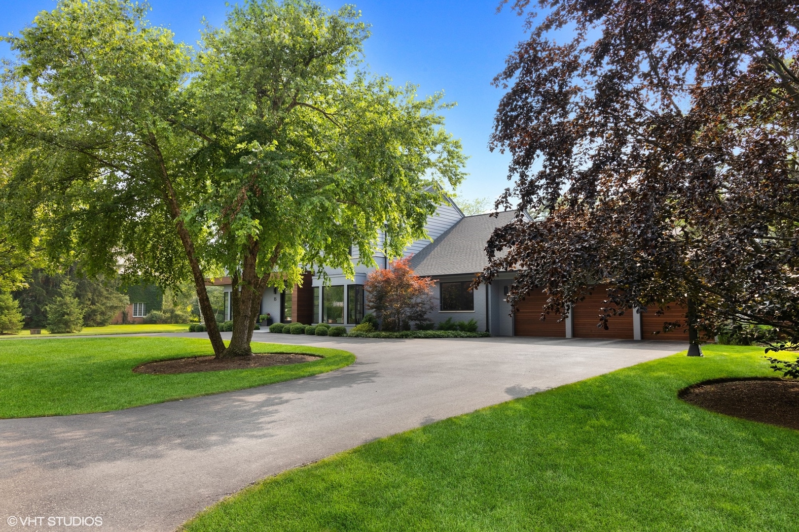15 Longmeadow Road Winnetka, IL 60093 - Photo 65 of 71 a front view of a house with a yard and trees