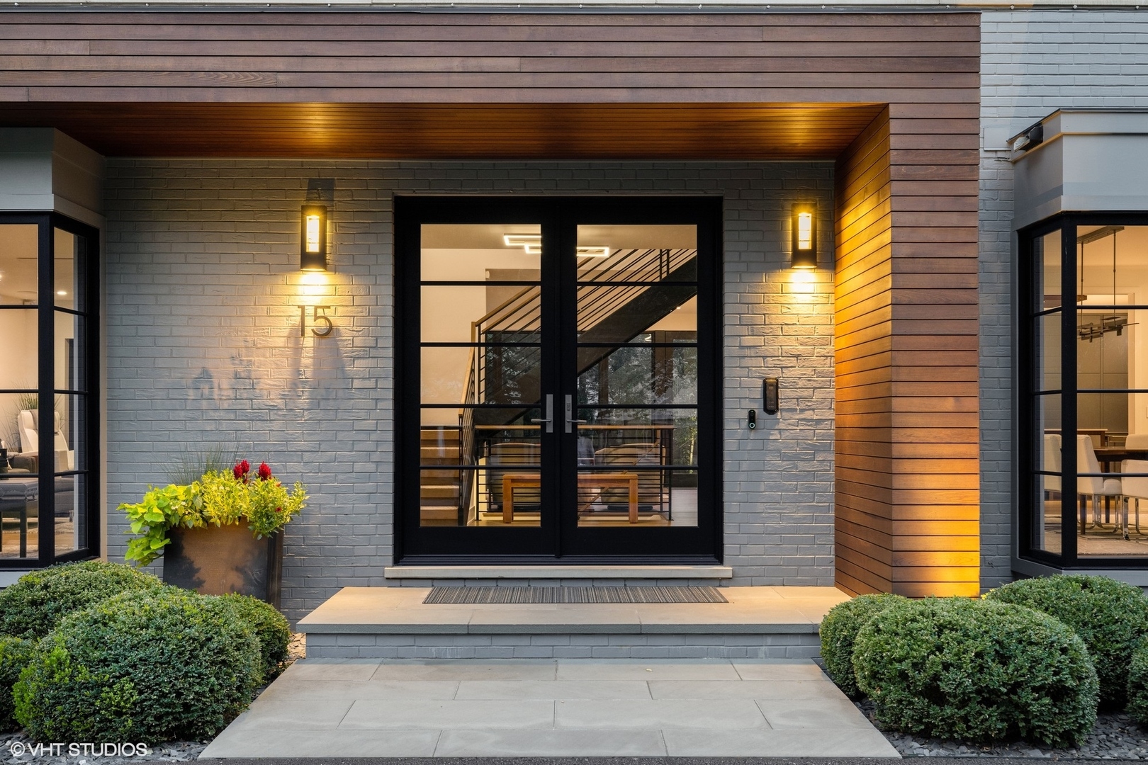 15 Longmeadow Road Winnetka, IL 60093 - Photo 67 of 71 a front view of a house with a potted plant and garage