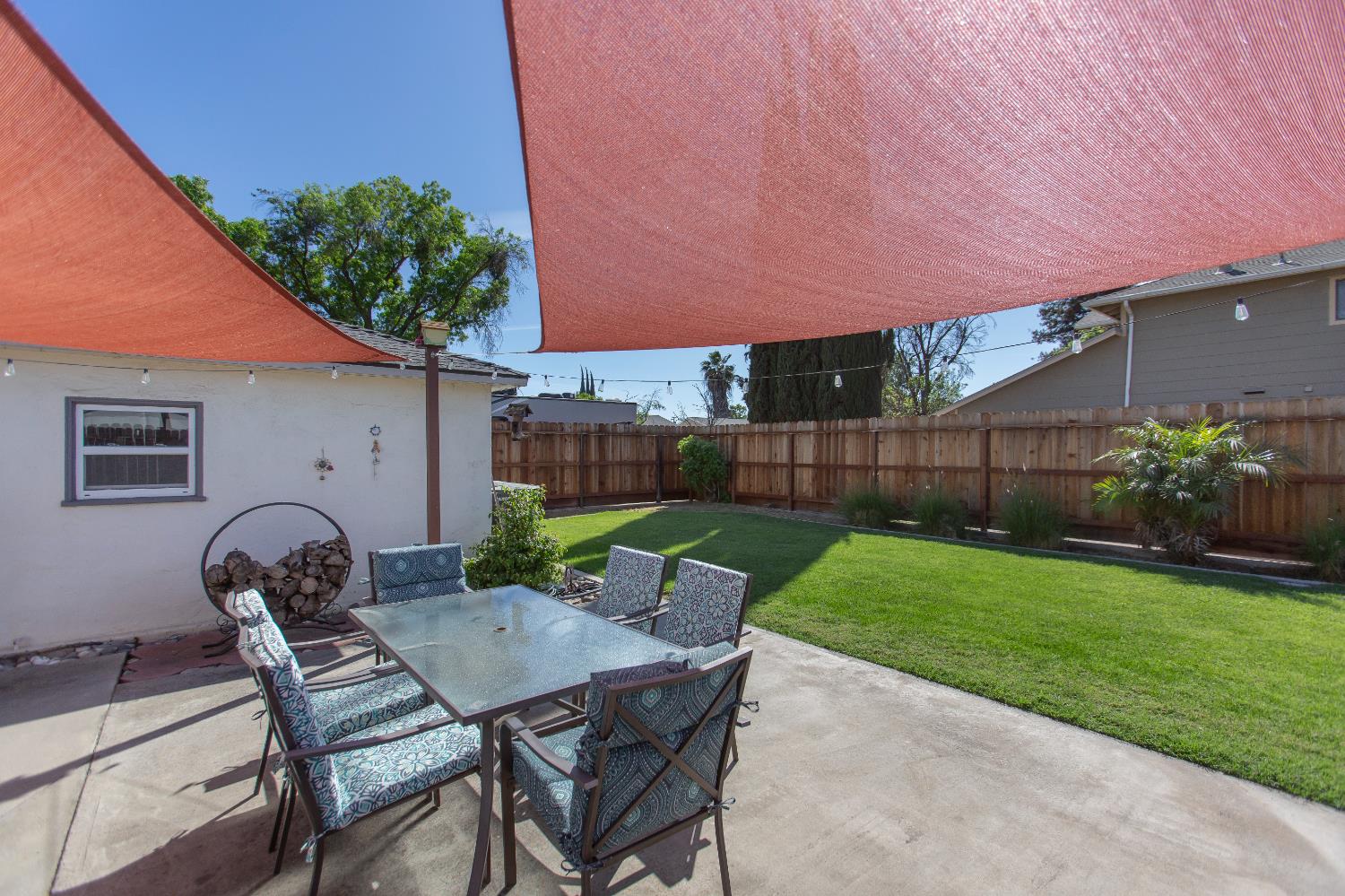 401 Fortuna Avenue Modesto, CA 95354 - Photo 23 of 43 a backyard of a house with table and chairs