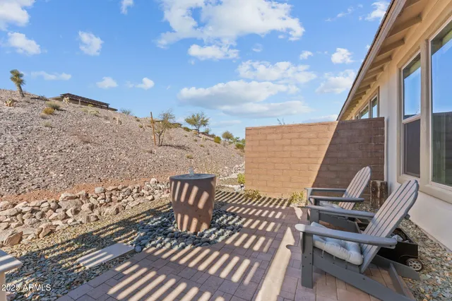 a view of a patio with couches chairs and potted plants