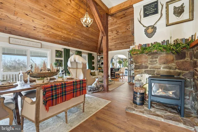 a living room with furniture and floor to ceiling windows