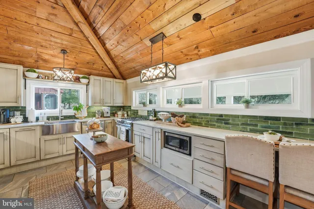 a view of a hallway with entryway wooden floor and front door