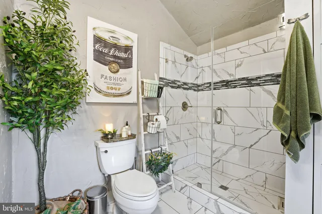 a kitchen with stainless steel appliances granite countertop a refrigerator and a stove