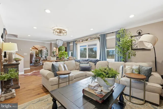 a view of a house with backyard porch and sitting area
