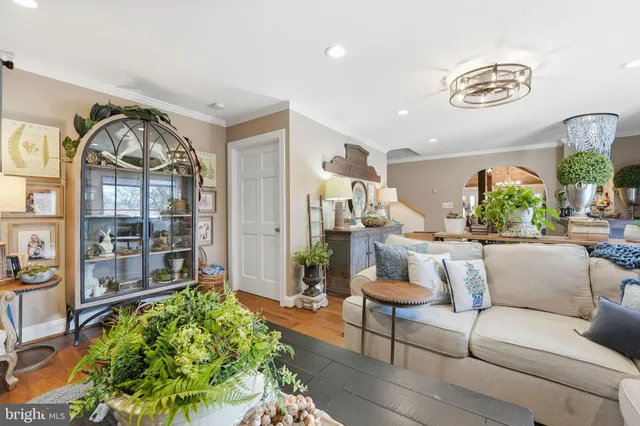 a view of a house with a yard and large tree