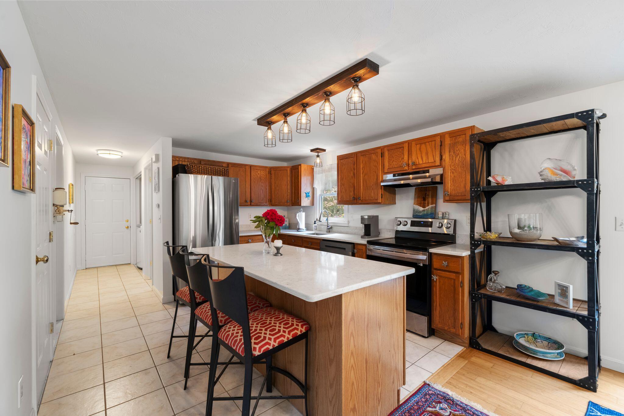 40 Sam Ryder Road Chatham, MA 02633 - Photo 14 of 42 a kitchen with stainless steel appliances granite countertop a sink and cabinets