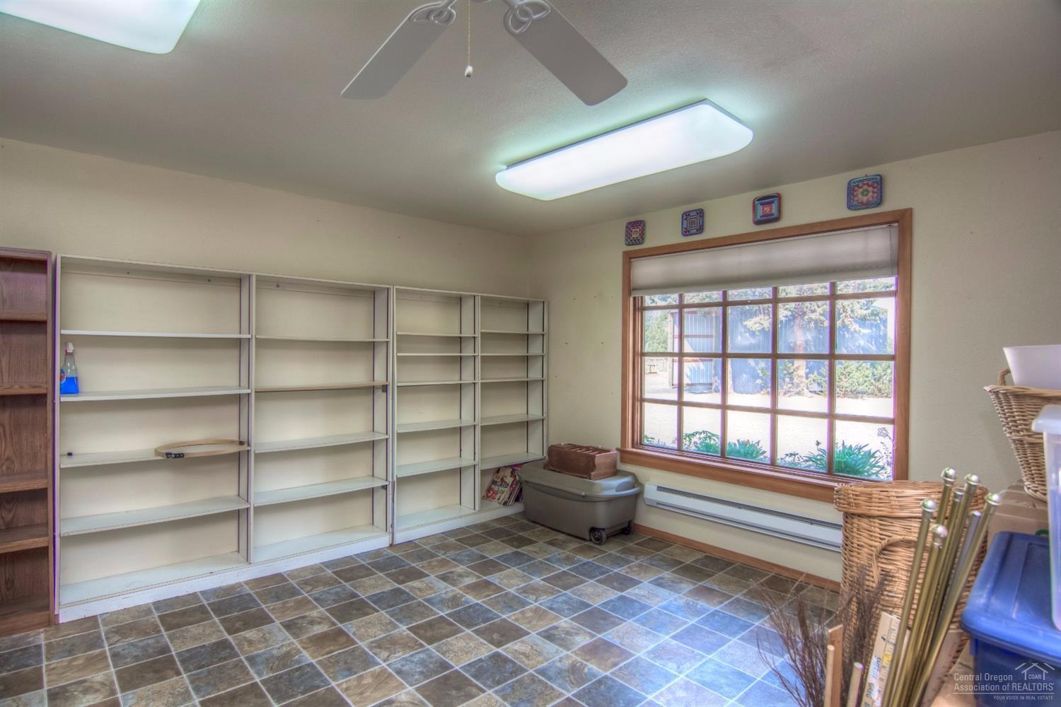 18762 Ridgecrest Road Bend, OR 97703 - Photo 22 of 25 a view of a room with shelves on the wall