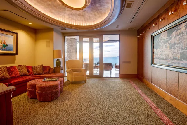 a backyard of a house with barbeque oven table and chairs