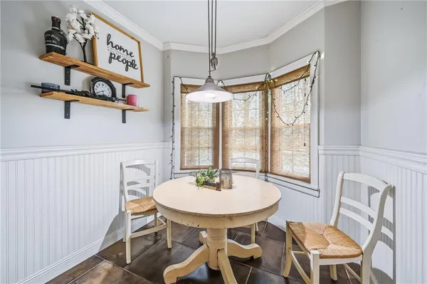 a dining room with furniture and window